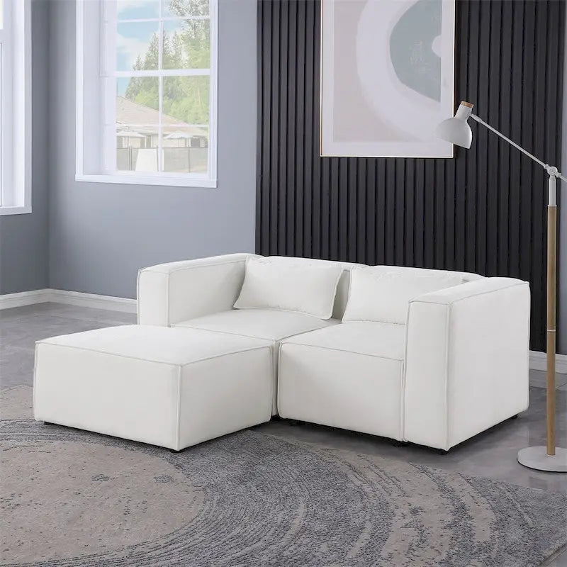 Divano in ciniglia con gambe e pouf
