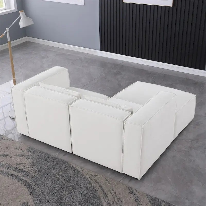 Divano in ciniglia con gambe e pouf