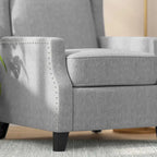 Poltrona reclinabile a molla con tasca laterale e finitura con borchie decorative