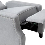 Poltrona reclinabile a molla con tasca laterale e finitura con borchie decorative