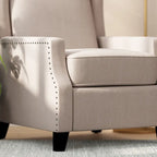 Poltrona reclinabile a molla con tasca laterale e finitura con borchie decorative